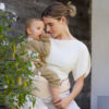 lift inward facing, lift facing in, lift hip carry, mom, outdoor, closeup